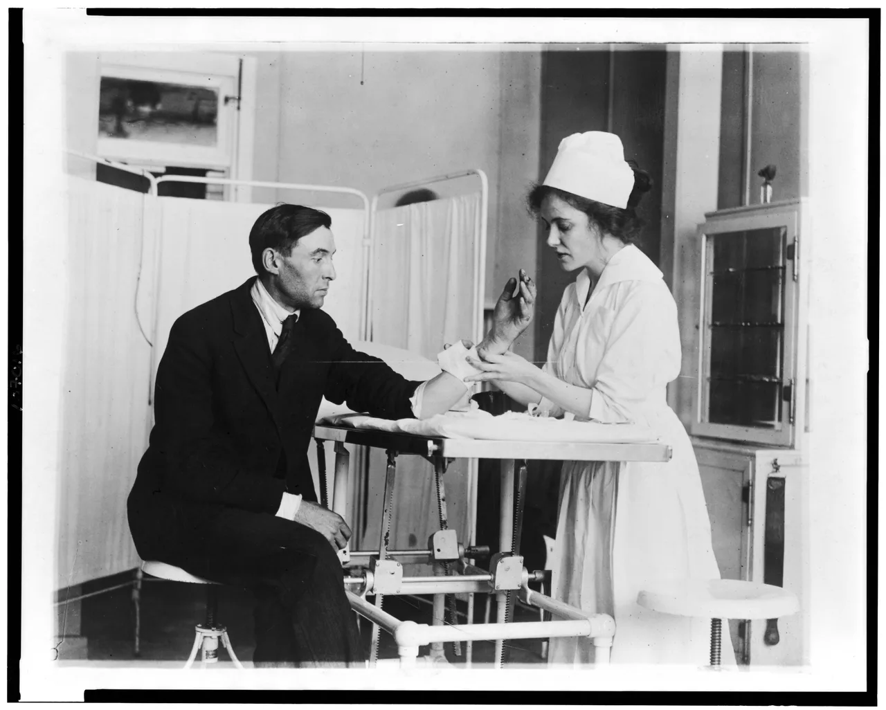 A Public Health Service nurse treating a patient in Washington, D.C., in 1918